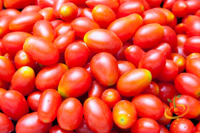 Red Pear Tomato Seeds | Close-up of vibrant red pear tomatoes with smooth skin and small oval shapes